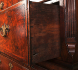 detail of a burr walnut antique chest on chest